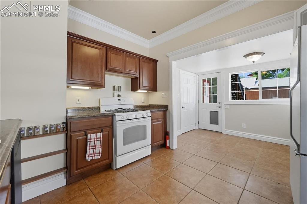 Image 12 of 48: Updated kitchen with gas stove.
