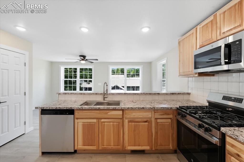 Image 24 of 48: All new appliances. Gas stove.