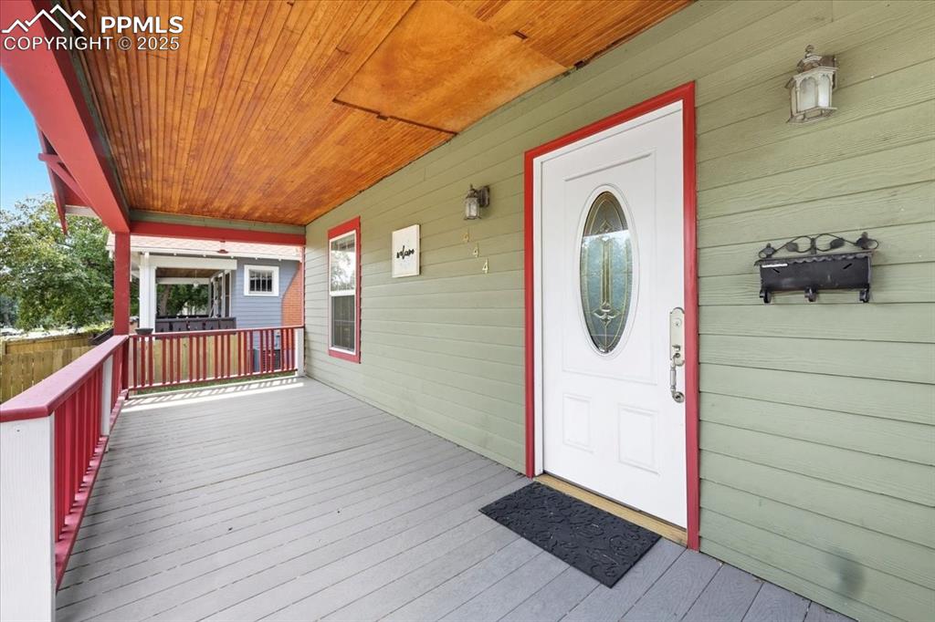 Image 4 of 48: Beautiful covered porch.