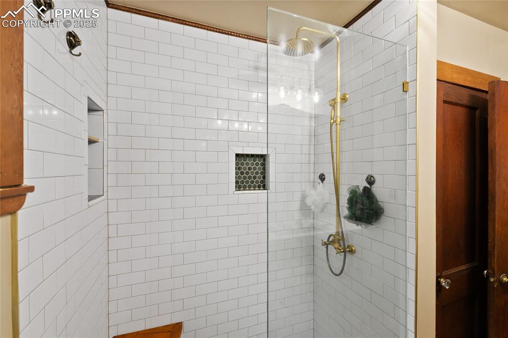 Image 15 of 43: Large shower in main level bathroom