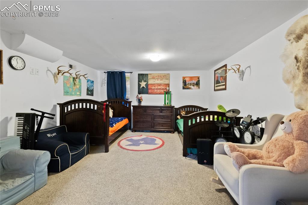 Image 17 of 43: Large Master Bedroom in Basement used as the kids room