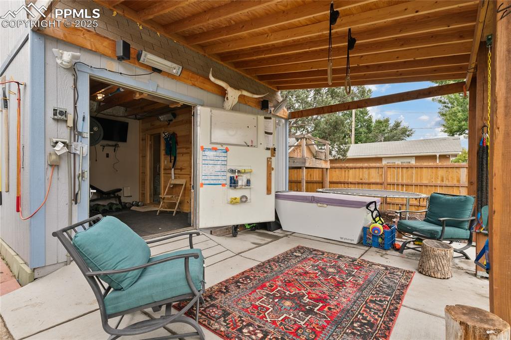 Image 24 of 43: Additional Covered Patio attached to Sauna / Gym