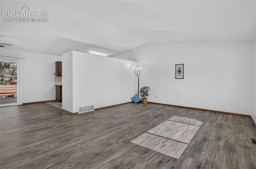 Image 5 of 50: Lioving Room Feature NewLVP/Luxury Vinyl Plank Flooring