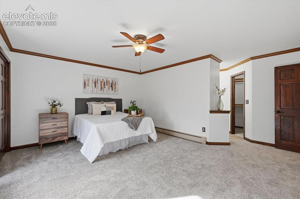 Image 16 of 46: White walls with wood trim detailing