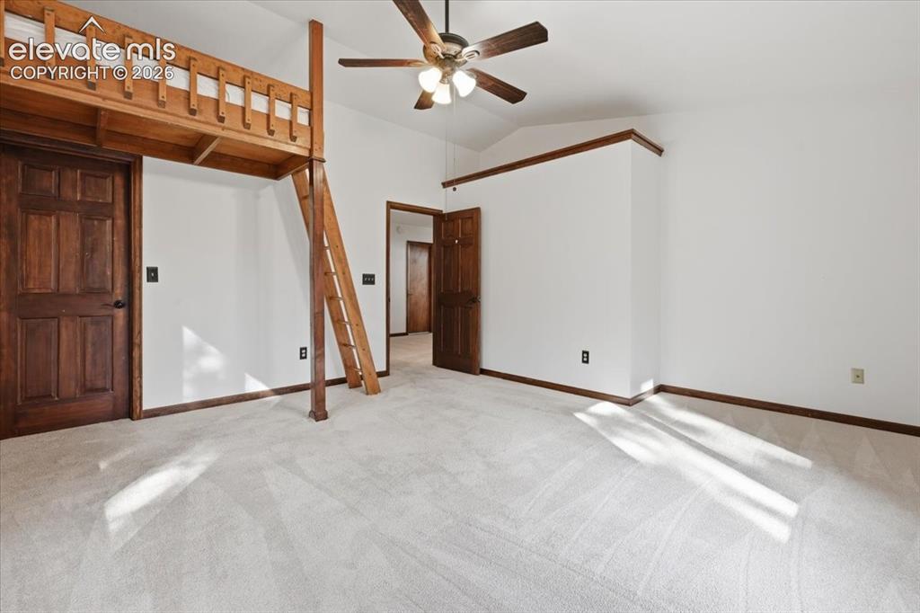 Image 22 of 46: Lofted bunk bed structure, vaulted ceiling, ceiling fan with light fixture,