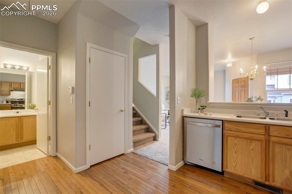 Image 11 of 31: Stainless steel appliances & oakwood floors. 