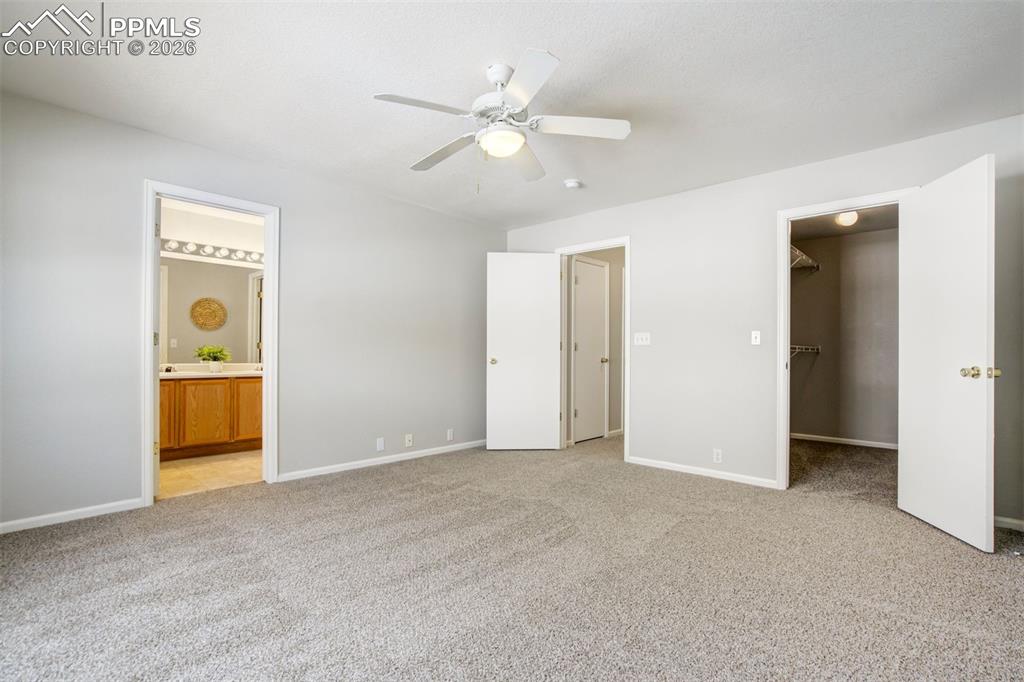 Image 15 of 31: A primary suite where you can retreat, relax, and pretend you’re not about 