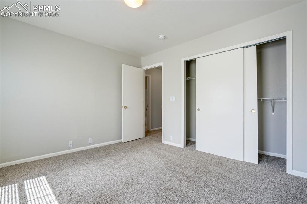 Image 22 of 31: A second bedroom with a bathroom right next door, perfect for guests, roomm