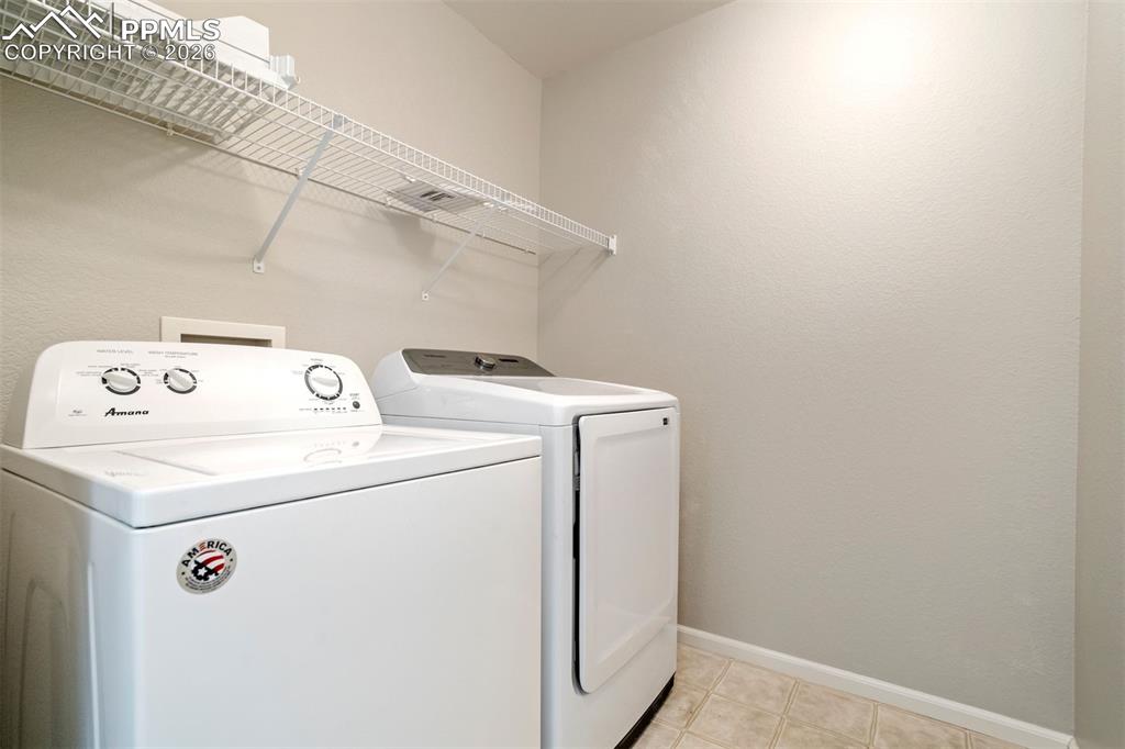 Image 26 of 31: Laundry room (no hallway laundry here). Washer & dryer included!