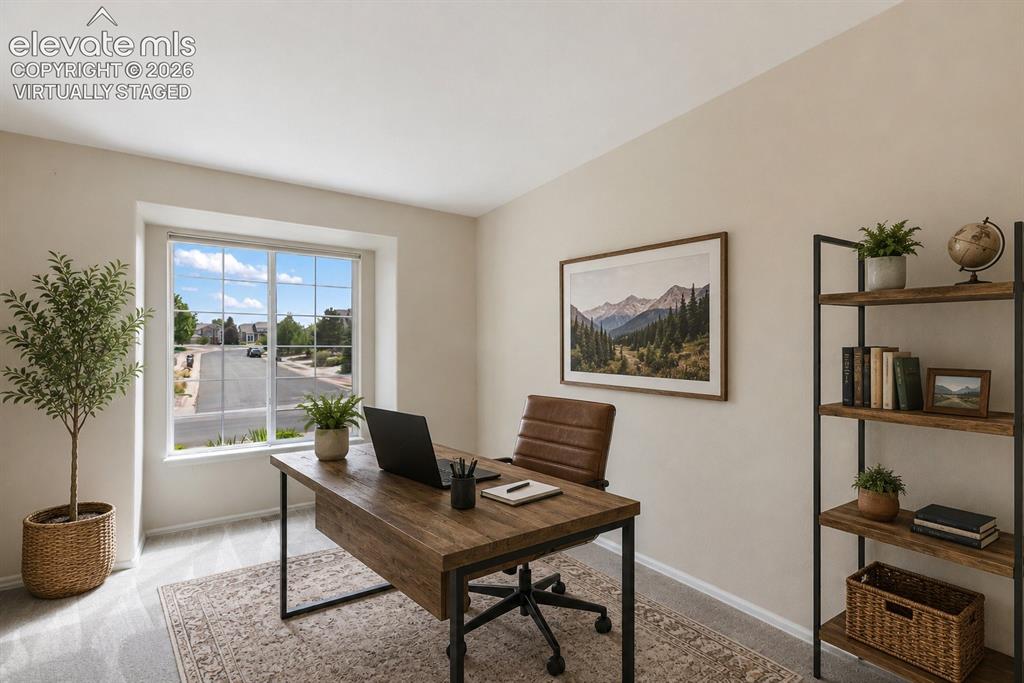 Image 16 of 50: Grand stair case from Living Room and Dining Room.