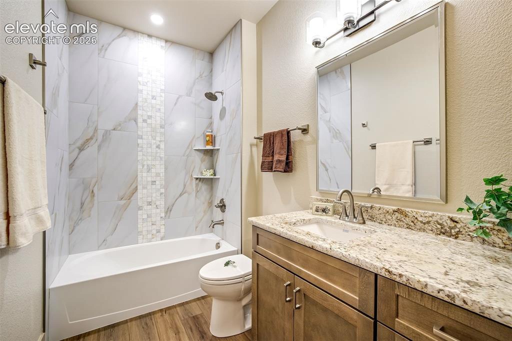 Image 29 of 48: Primary bedroom with access to walk in closet and spa like bath.