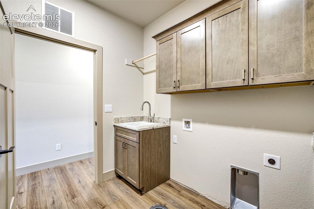 Image 31 of 48: Spacious vanity with dual sinks and lots of storage available.
