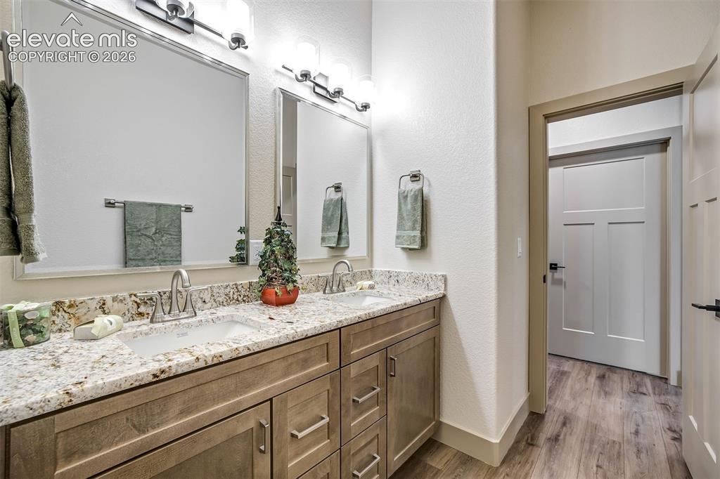 Image 42 of 48: Laundry with sink and access to garage.
