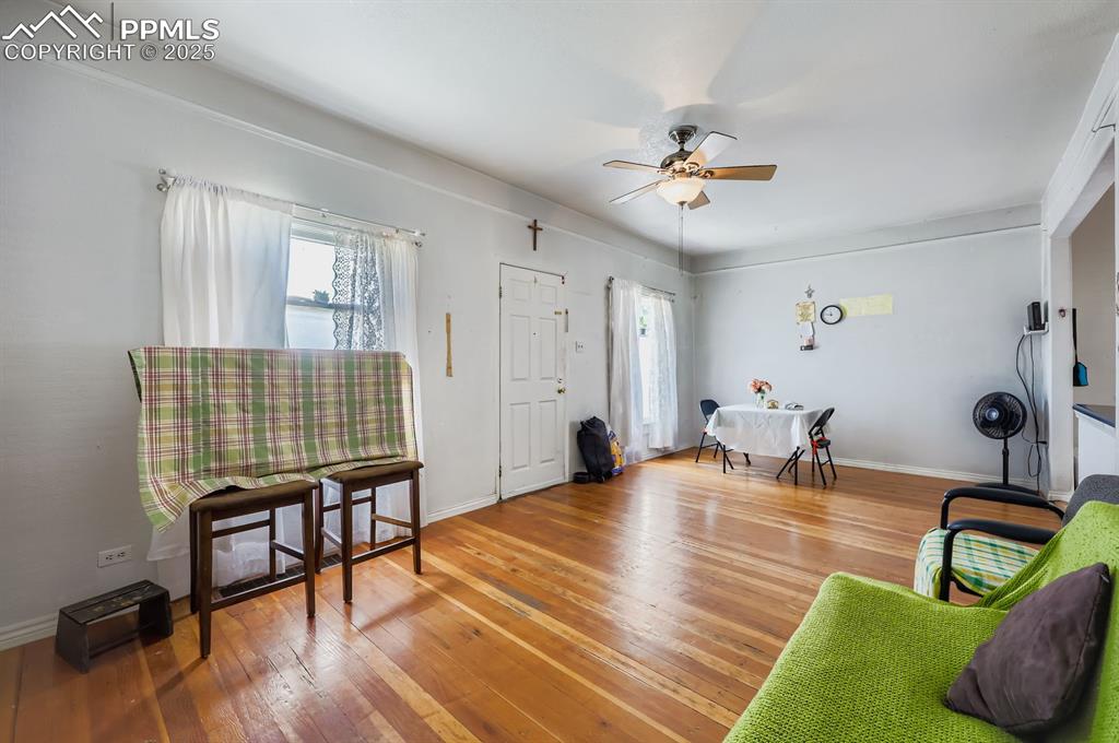 Image 2 of 10: Living area with hardwood / wood-style floors, plenty of natural light, and