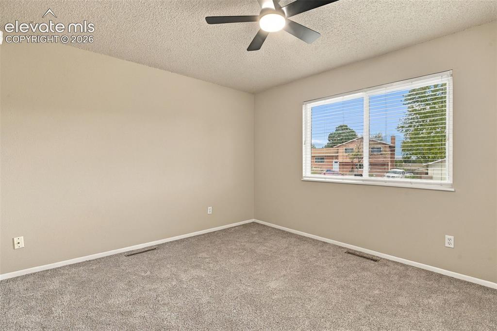 Image 18 of 50: Interior room featuring neutral wall paint, wall-to-wall carpeting, a large