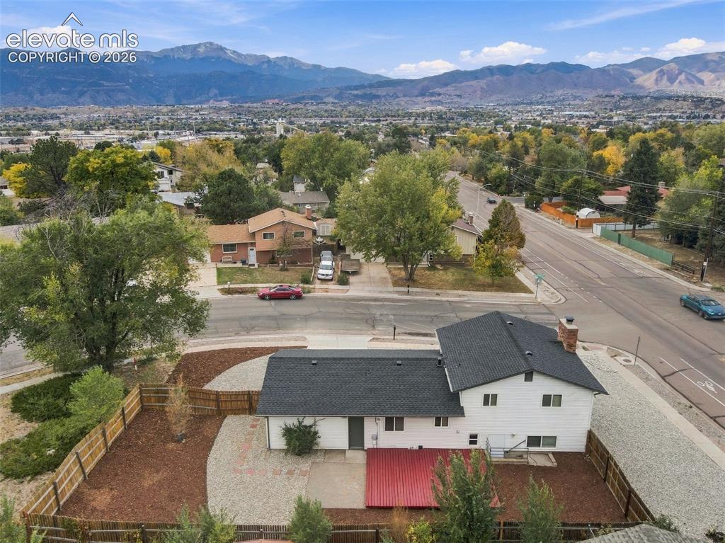 Image 35 of 50: Aerial perspective of property featuring a multi-level residence with dark 