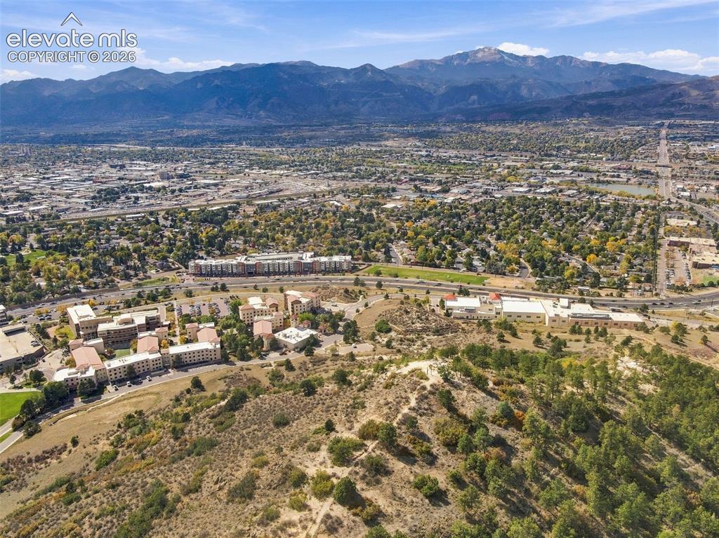 Image 39 of 50: Aerial perspective showcasing extensive mountain range topography and expan