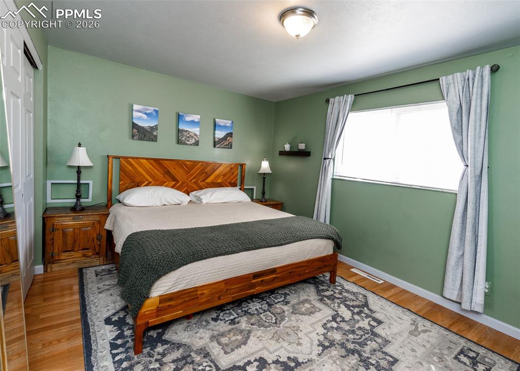 Image 27 of 39: Bedroom featuring a closet and light wood-style floors