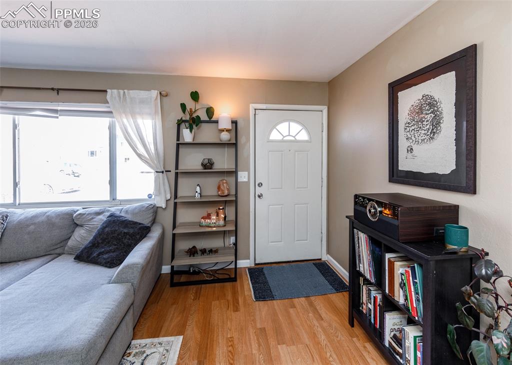 Image 3 of 39: Entrance foyer with light wood-type flooring and baseboards