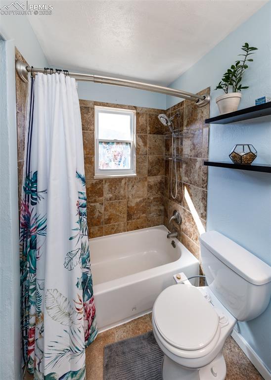 Image 37 of 39: Full bathroom with toilet and shower / bath combo