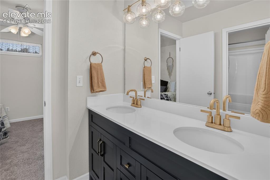 Image 12 of 20: Full bath w/ dual sink vanity - upper level
