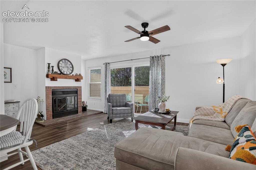 Image 3 of 20: Living room w/ fireplace & walk-out