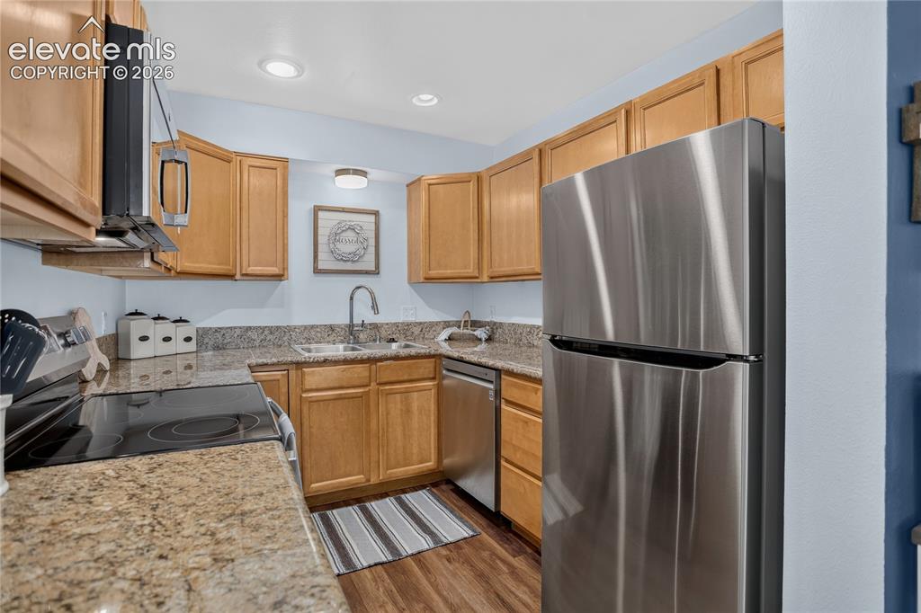 Image 6 of 20: Kitchen w/ SS appliances