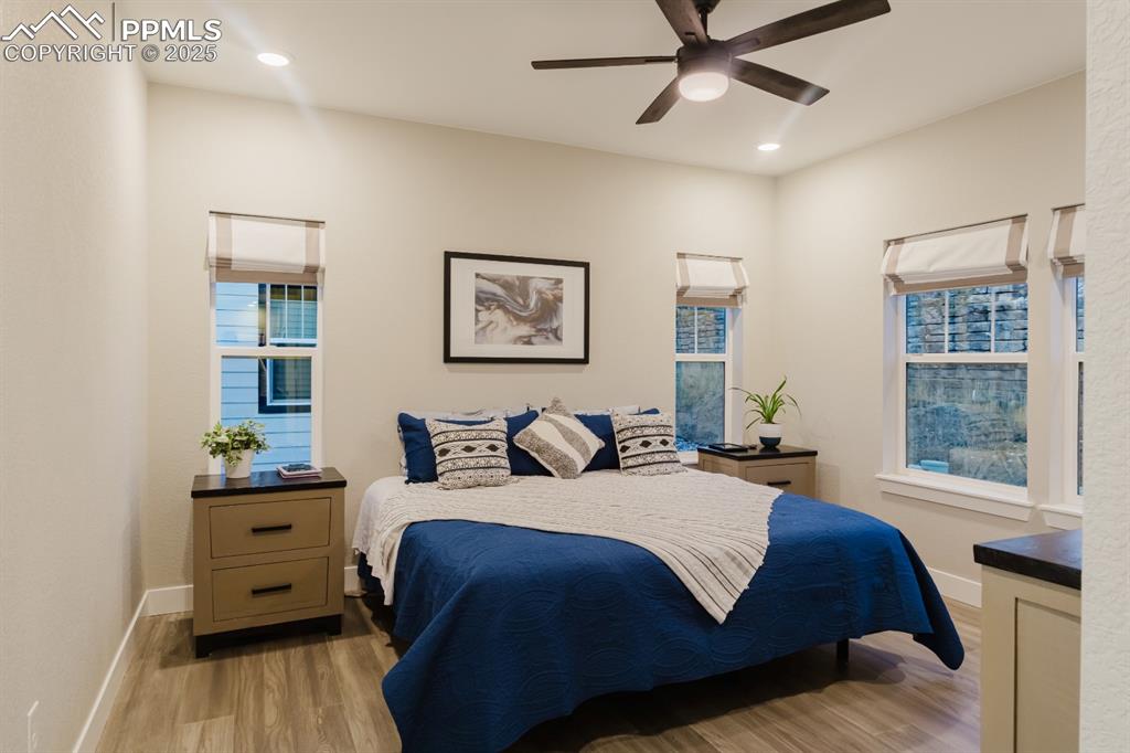 Image 10 of 31: The primary bedroom is located in the back of the home and has plenty of ro