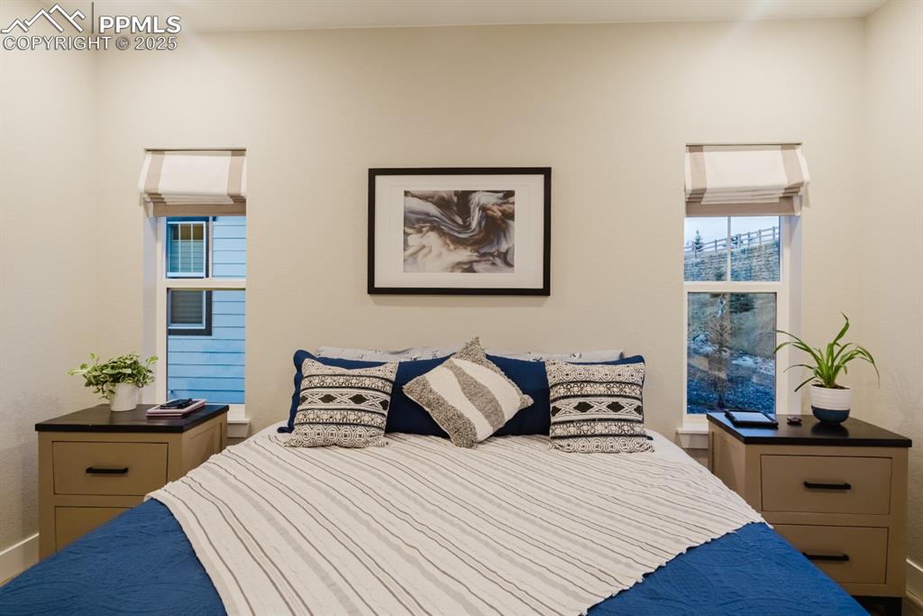 Image 11 of 31: Love these perfectly placed windows in the primary bedroom!