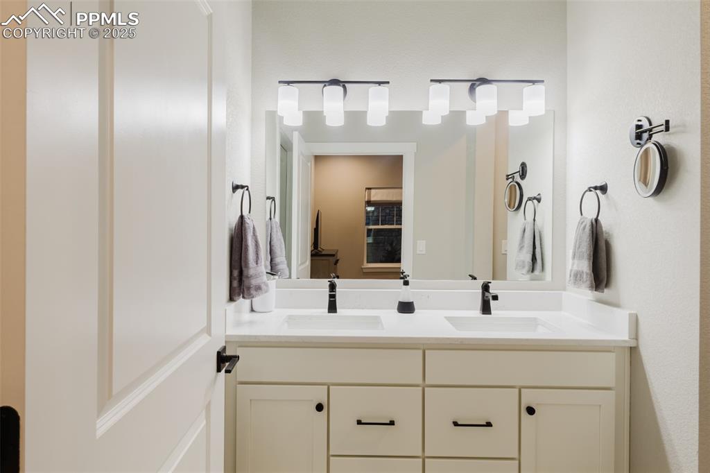 Image 13 of 31: With dual vanities and plenty of storage, this primary bathroom is as funct