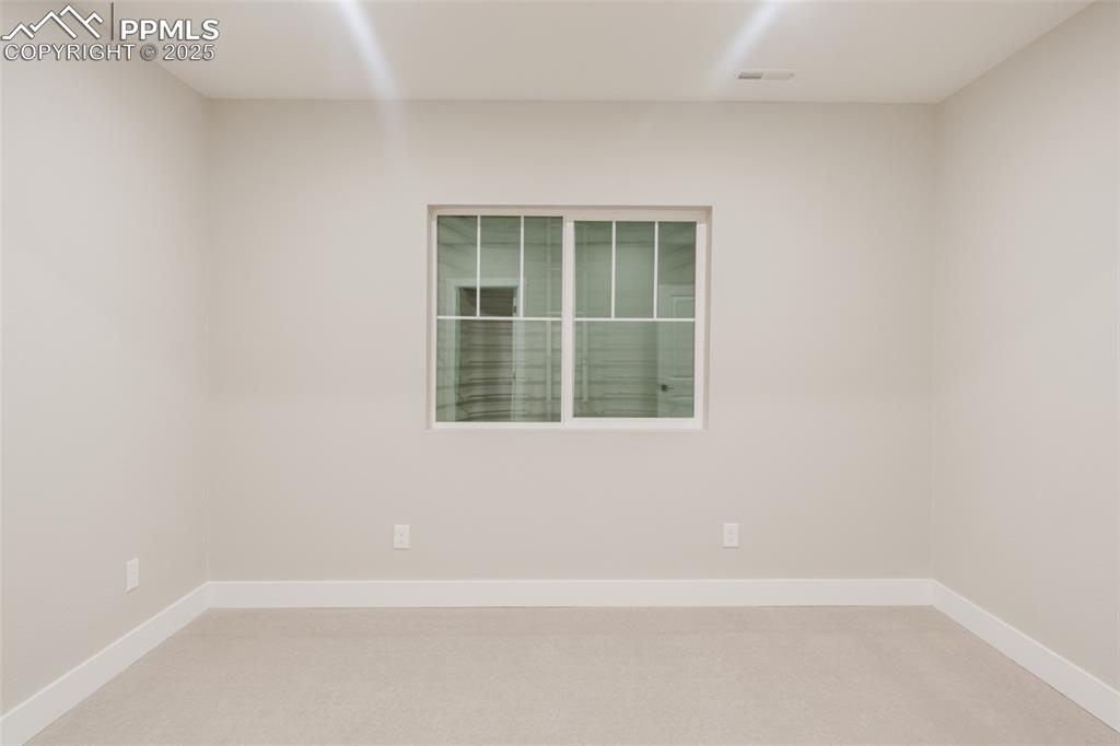 Image 26 of 31: This basement-level bedroom has a walk-in closet 