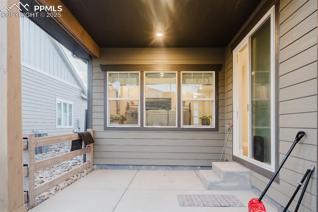 Image 29 of 31: The covered patio is the perfect spot to relax outside. 