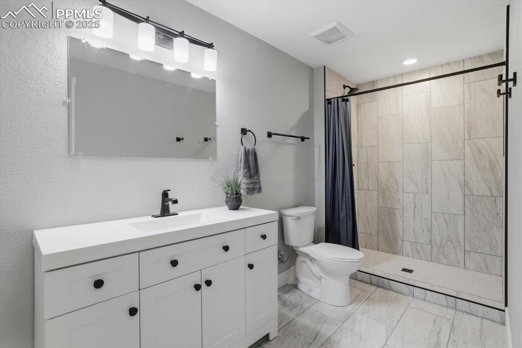 Image 32 of 45: This newly finished 3/4 bath is located on the basement level.