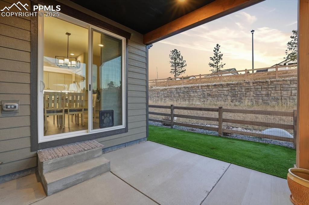 Image 40 of 45: There is a gas line to the left of the sliding glass door for easy access t