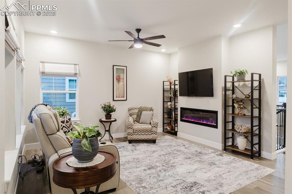 Image 6 of 31: The linear gas fireplace gives the home a modern touch. 