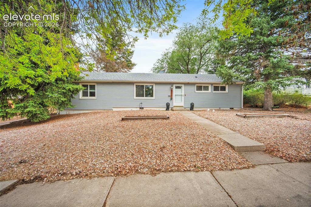 Image 1 of 43: Light gray siding exterior with a white front entry door