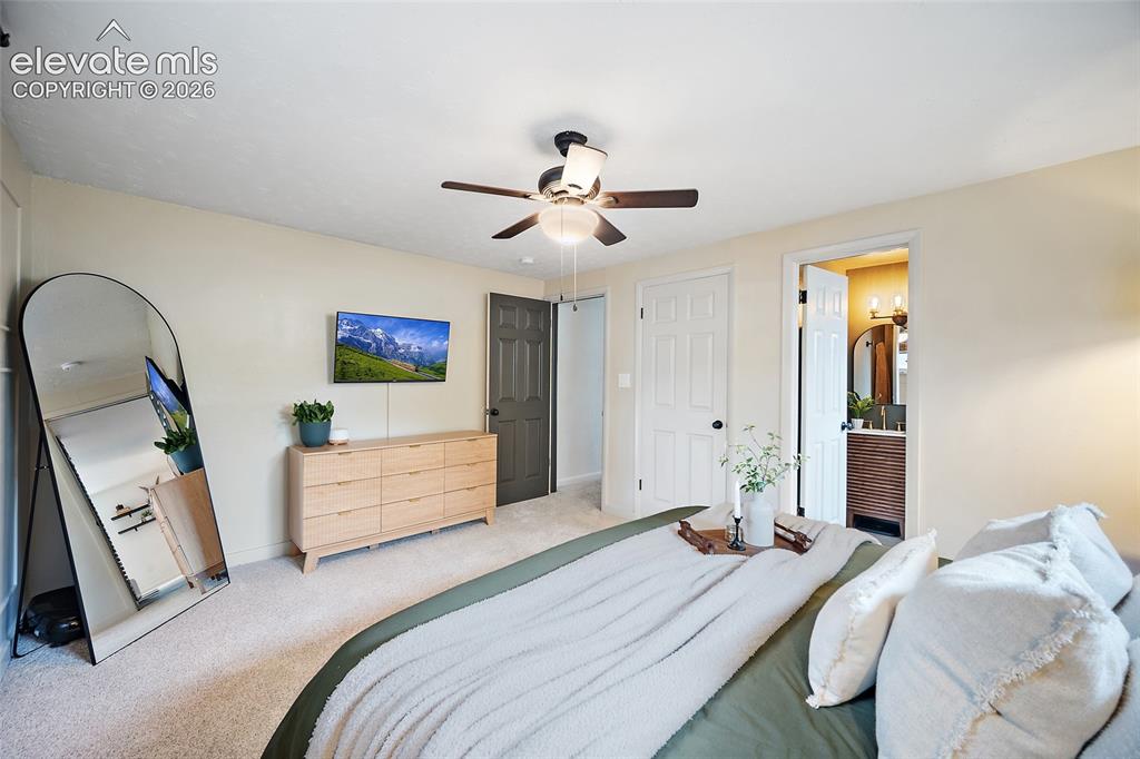 Image 24 of 43: Plush carpeting throughout, neutral wall tones, and a ceiling fan with inte