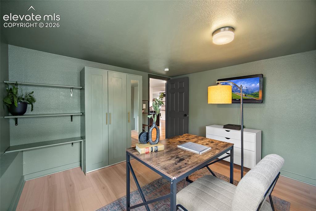 Image 28 of 43: Neutral-toned flooring complements built-in shelving and cabinetry