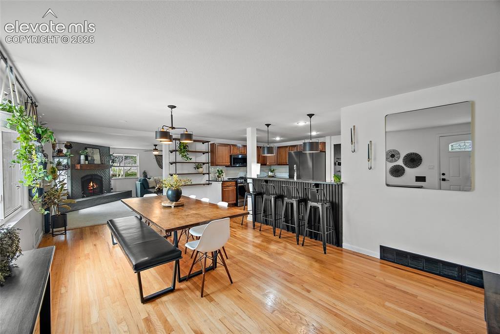 Image 4 of 43: Hardwood-finish flooring extending through an open-concept living area