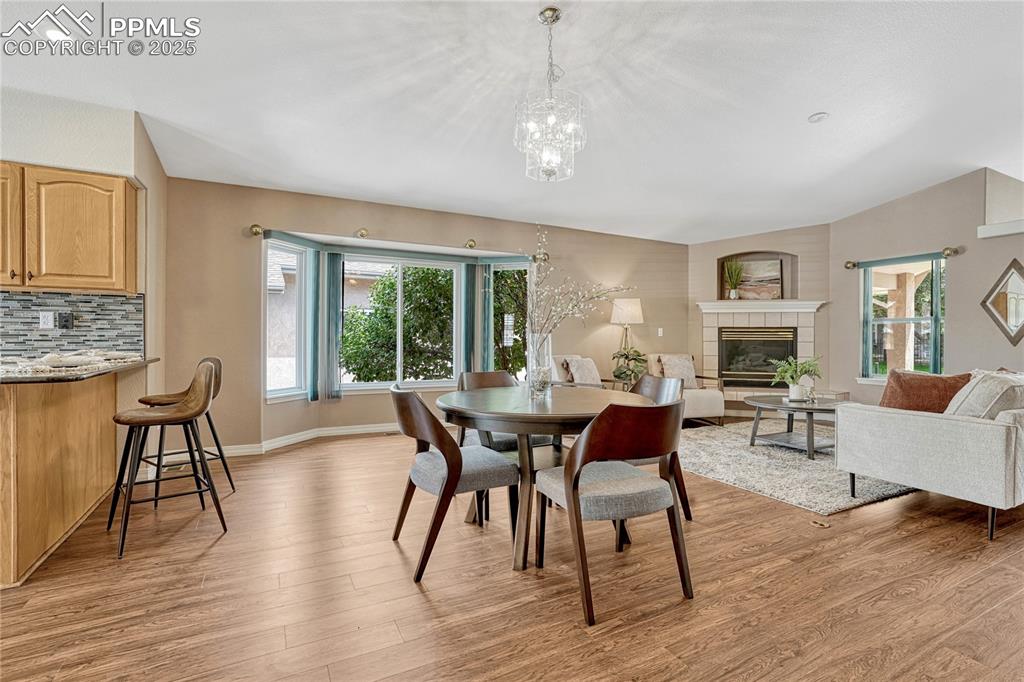 Image 14 of 38: Dining area with large bay window.
