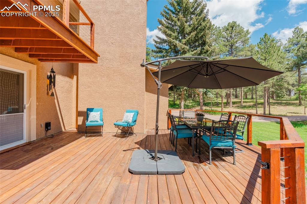 Image 33 of 41: Deck with outdoor dining area