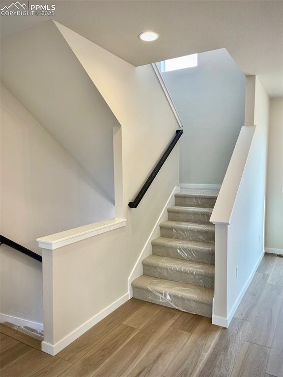 Image 12 of 25: Stairs to upper level