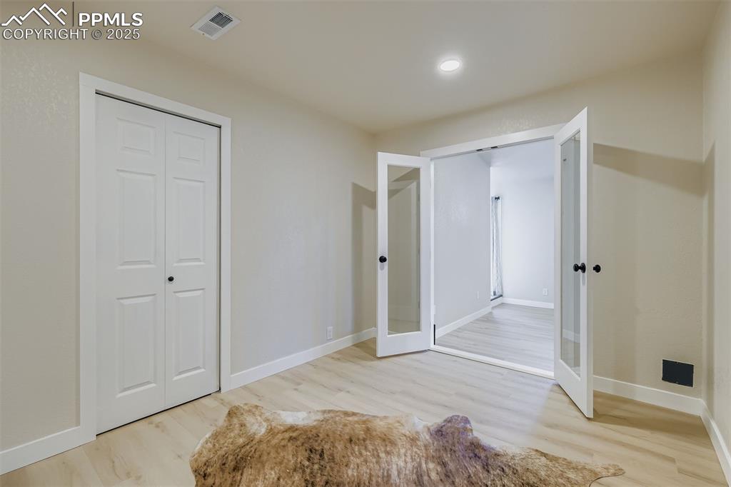 Image 18 of 31: Office/den/non-conforming bedroom w/closet and french doors