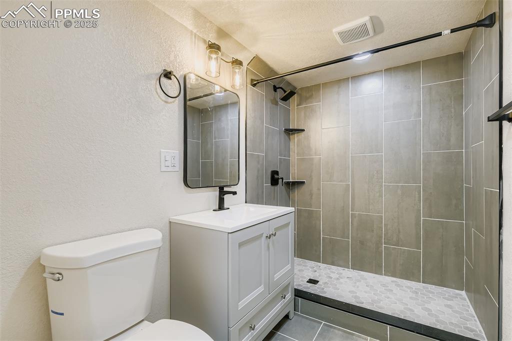 Image 23 of 31: Custom bath in basement