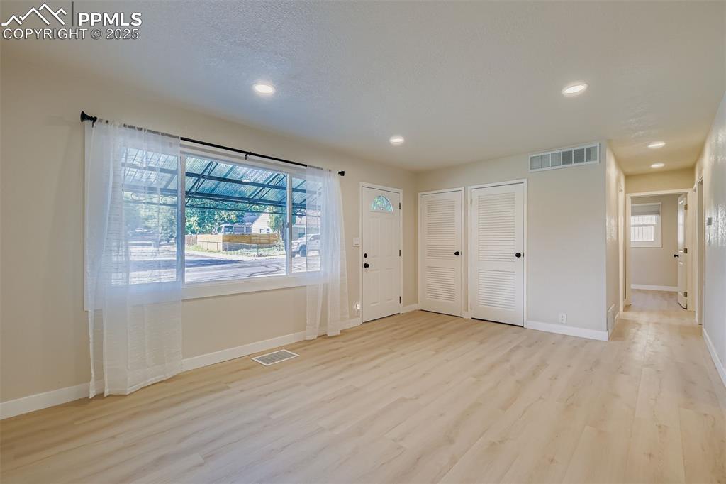 Image 5 of 31: Main Entryway and sitting/front living room
