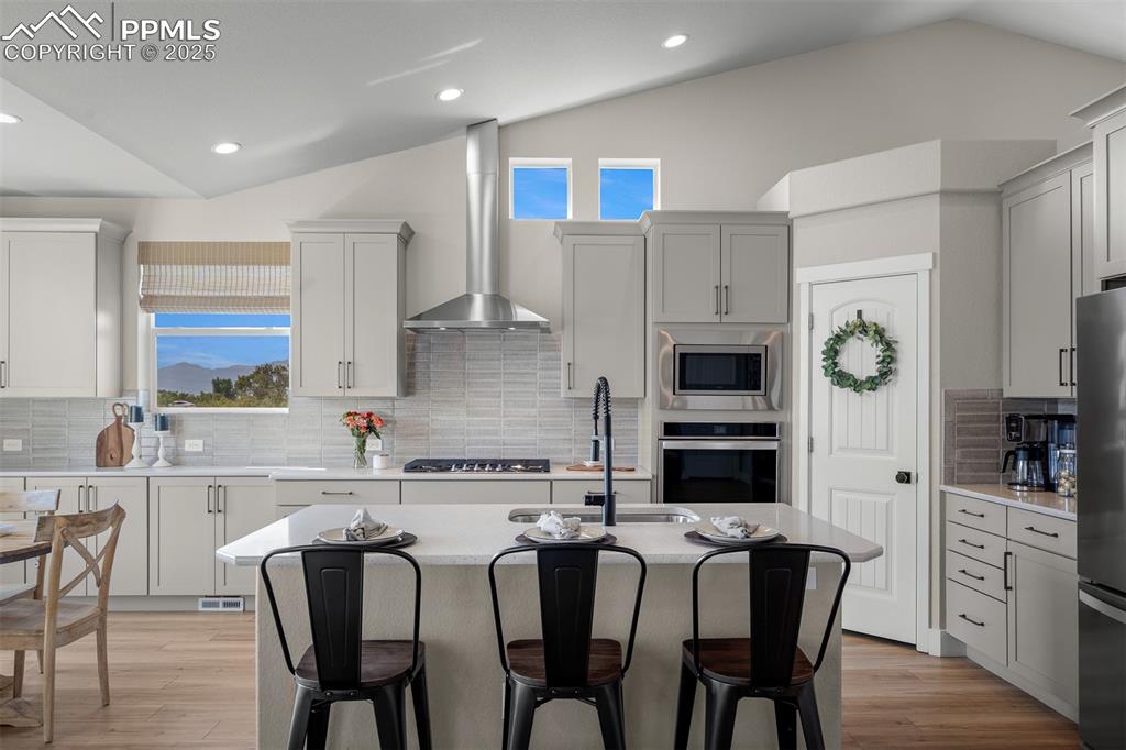 Image 12 of 37: Kitchen with vaulted ceiling and more mountain Views