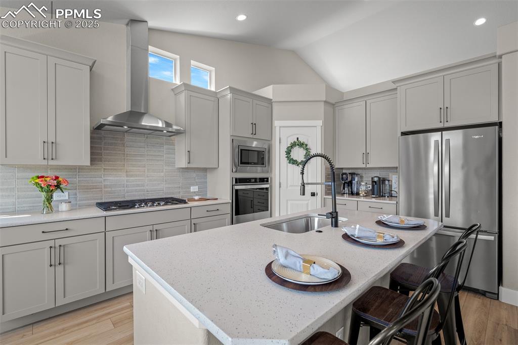Image 13 of 37: Quartz countertops, down draft, pantry, gas stove