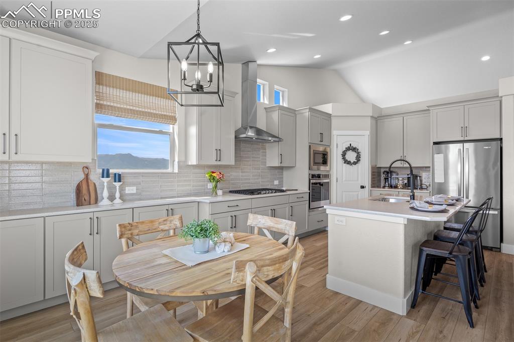 Image 15 of 37: Eat in Breakfast Nook with extended cabinetry and more mountain views!