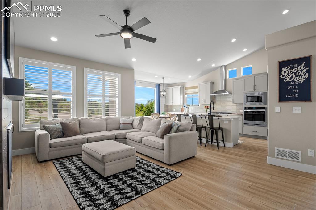 Image 9 of 37: Open Floorplan witih vaulted Ceiling and natural light