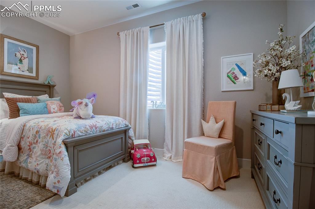 Image 29 of 29: Bedroom featuring light colored carpet and baseboards
